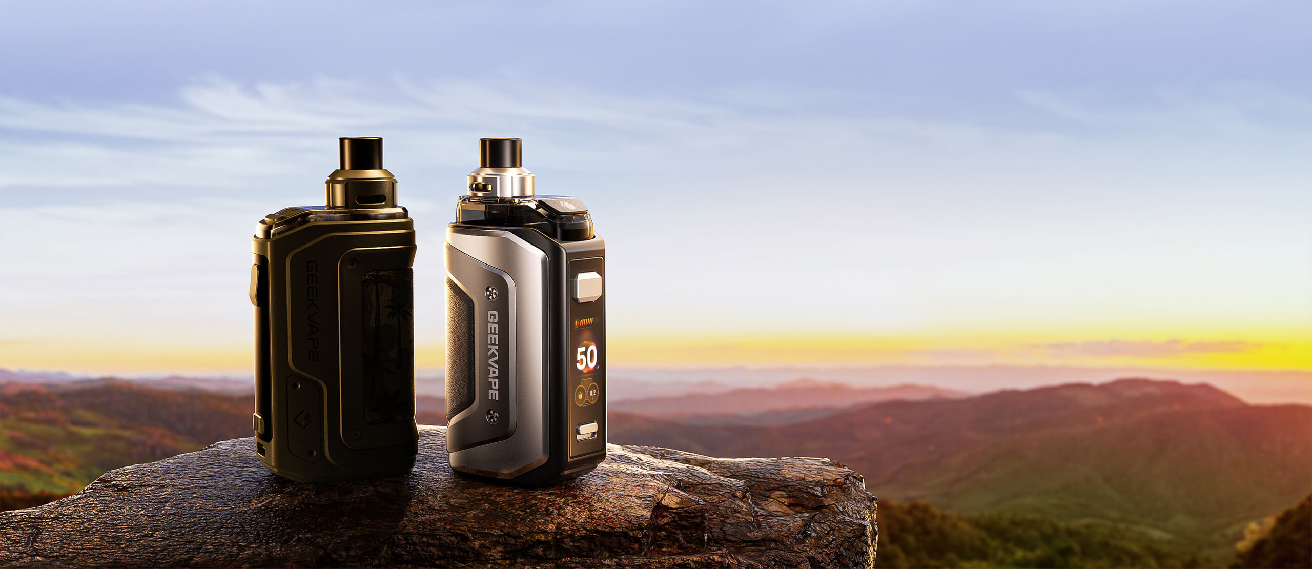GeekVape Aegis Hero 5 — deux coloris sur un rocher au coucher de soleil
